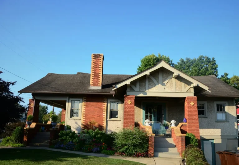 The Heights Bungalow, a brick craftsman bungalow with a deep front porch
